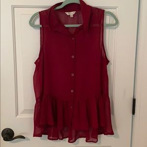 Sleeveless peplum style blouse with buttons